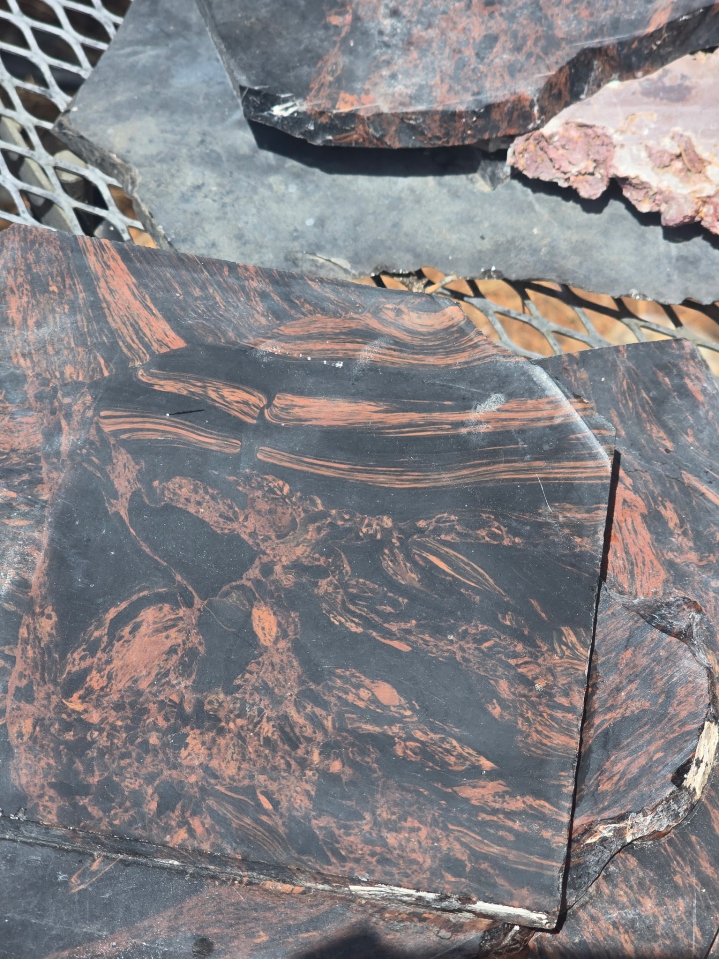 Close-up of banded rainbow obsidian from the shop